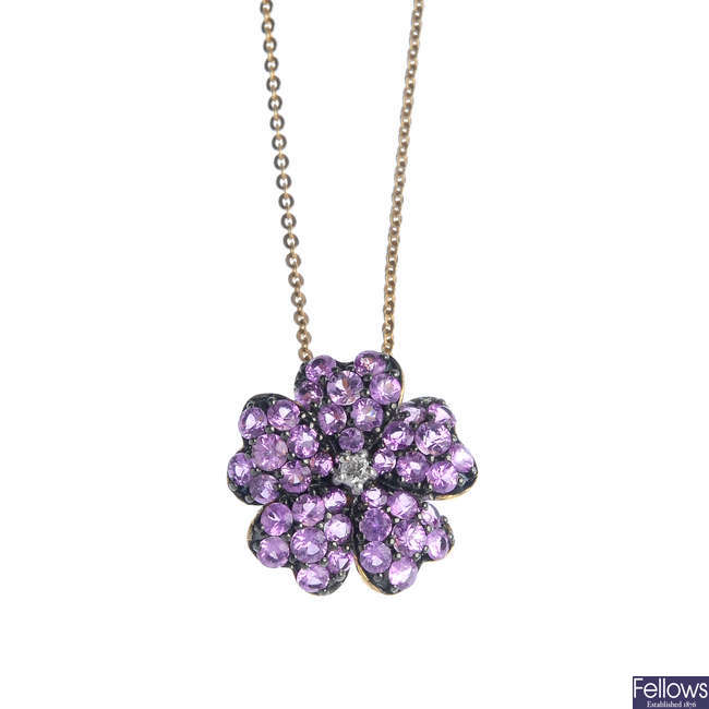 A 9ct gold diamond and sapphire floral pendant, with chain.
