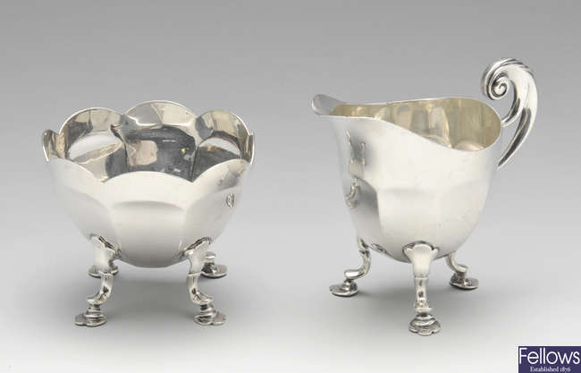 A late Victorian silver cream jug and sugar bowl.