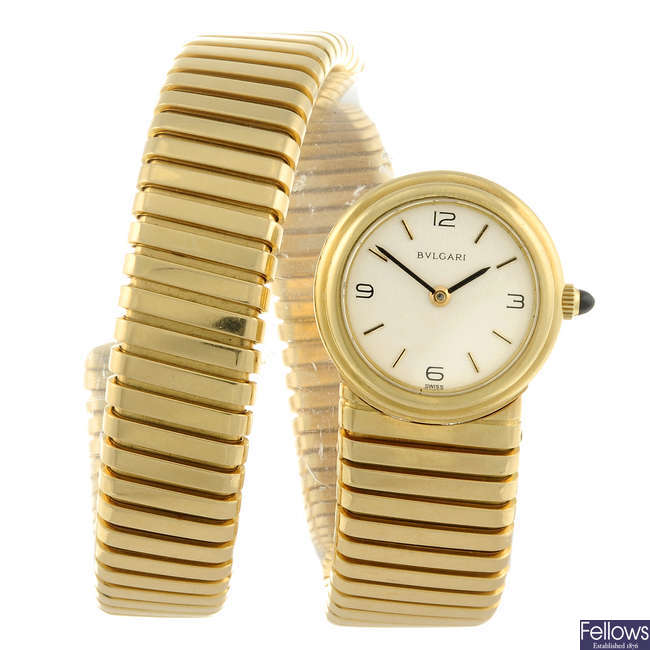 BULGARI - a lady's yellow metal Tubogas bracelet watch.