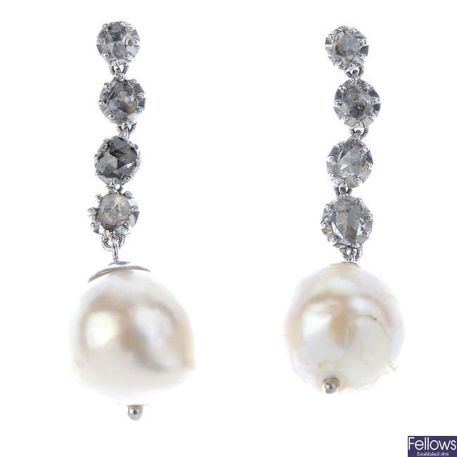 A pair of pearl and diamond earrings. 