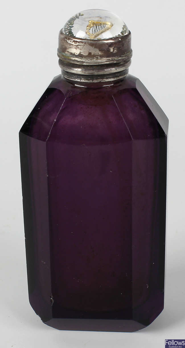 A Victorian amethyst glass scent bottle.