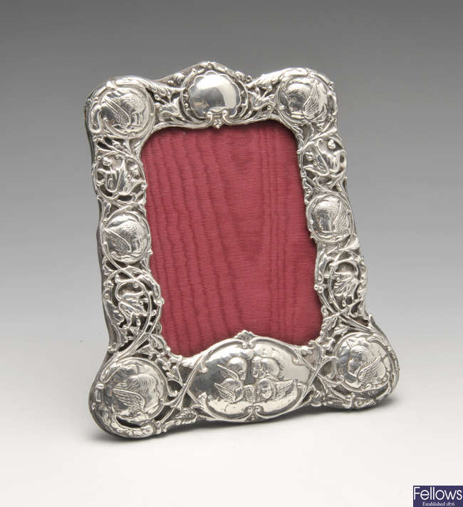 A late Victorian silver mounted photograph frame.
