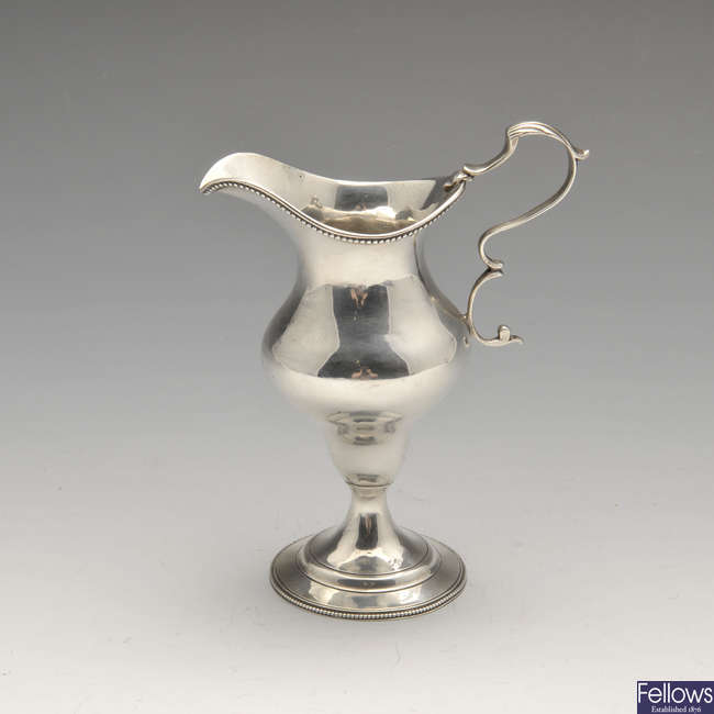A George III silver cream jug by Hester Bateman.