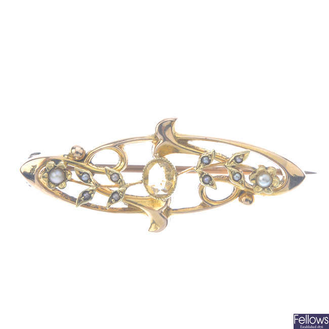 An early 20th century 15ct gold citrine and split-pearl brooch.
