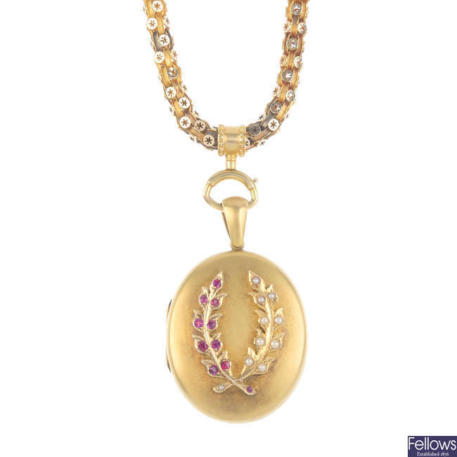 A late 19th century gold ruby and split pearl locket.