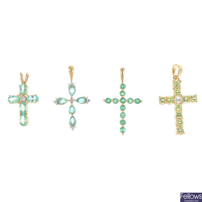 Four 9ct gold gem-set cross pendants.