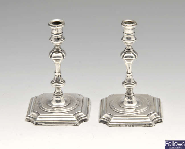 A pair of Edwardian silver mounted tapersticks.