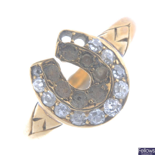 A late Victorian 18ct gold gem-set horseshoe ring.