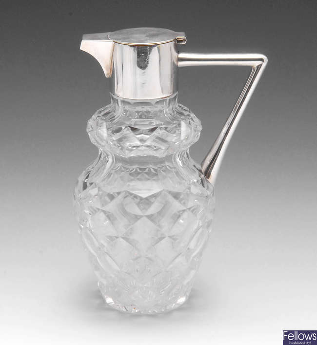 A late Victorian silver claret jug.