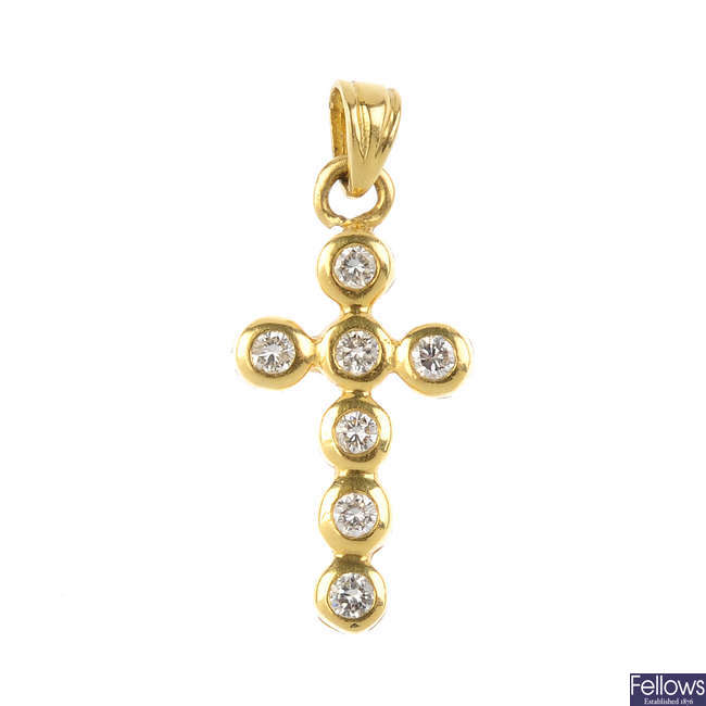 An 18ct gold diamond cross pendant.