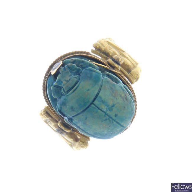 An early 20th century gold faience scarab ring.