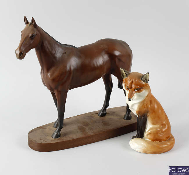 A Royal Worcester fox together with a Beswick horse.