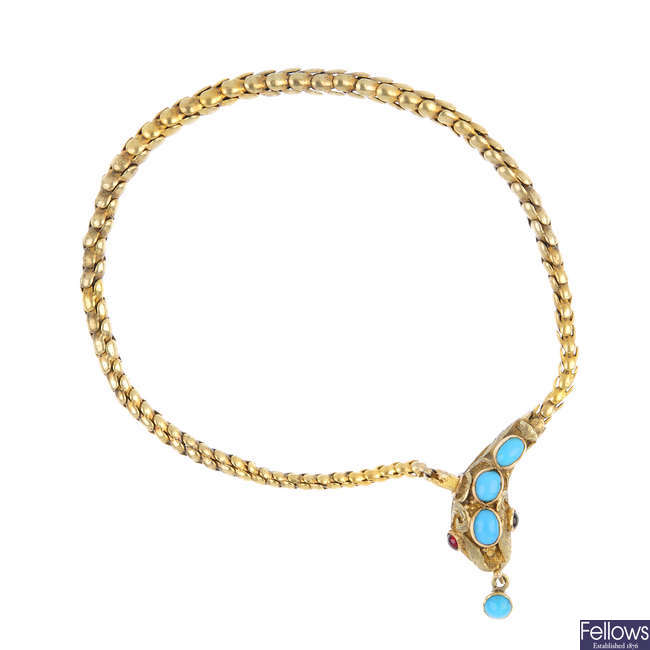 A late Victorian gold gem-set snake bracelet.