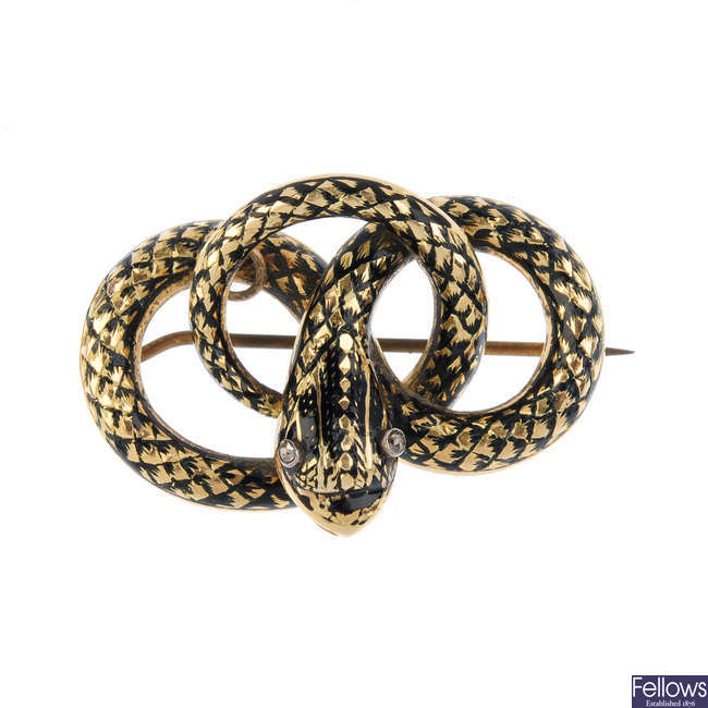 An early Victorian gold enamel and diamond memorial snake brooch. 