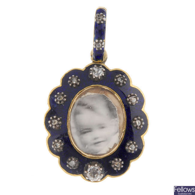 A mid Victorian enamel and diamond photograph pendant.