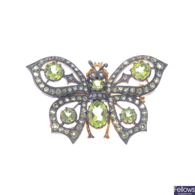 A gem-set butterfly brooch.