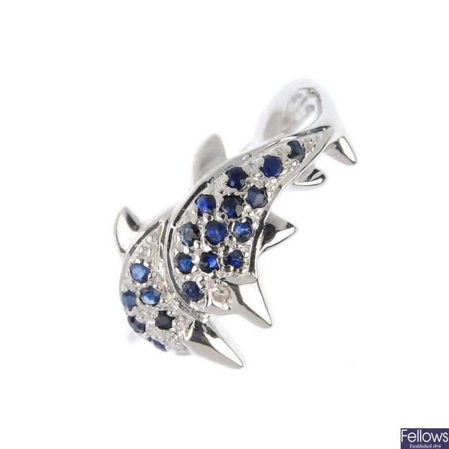 A 9ct gold sapphire and diamond dolphin ring.