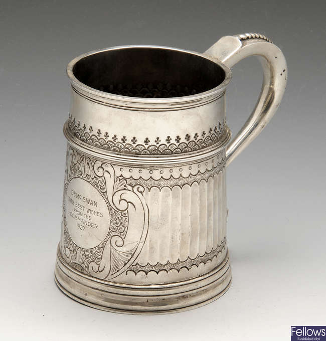 A 1920's silver mug.