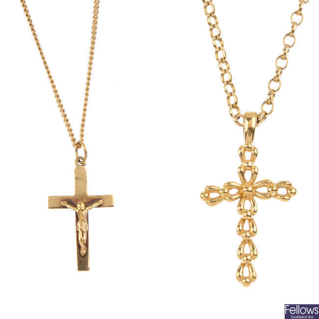Two 9ct gold cross pendants, with chains.
