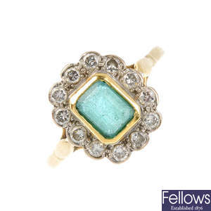 An 18ct gold emerald and diamond ring.