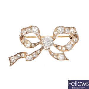A late Victorian silver and gold diamond bow brooch, circa 1880.
