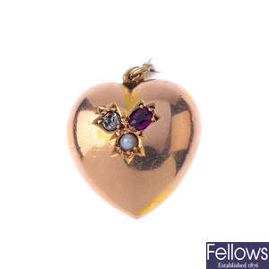 A late Victorian 15ct gold ruby, diamond and split pearl heart pendant.