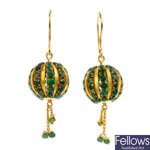A pair of emerald earrings. 