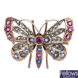 A late Victorian silver and gold, gem-set butterfly brooch.
