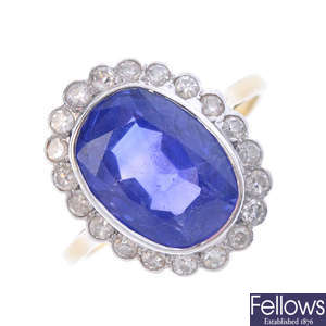 A Ceylon sapphire and diamond cluster ring.