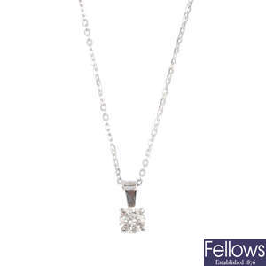 A diamond single-stone pendant with chain.