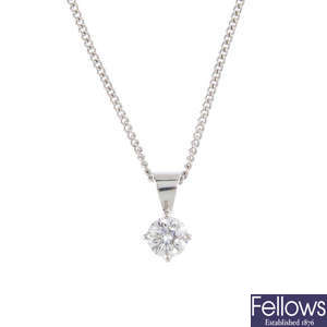 An 18ct gold diamond single-stone pendant with chain.