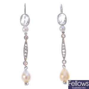 A pair of natural saltwater pearl and diamond earrings.