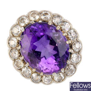 A mid 20th century 18ct gold amethyst and diamond cluster ring.