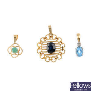Seven gem-set pendants.
