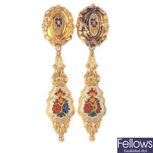 A pair of gold enamel earrings.