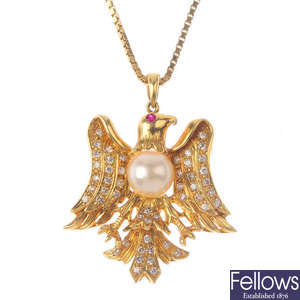 A cultured pearl and diamond eagle pendant, with chain.