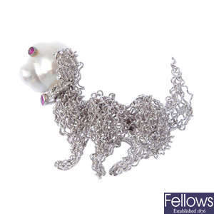 A diamond and gem-set novelty dog brooch.