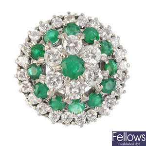 An 18ct gold diamond and emerald cluster ring.
