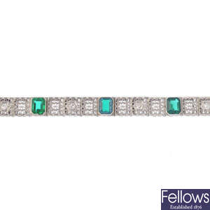 A diamond and green paste bracelet.