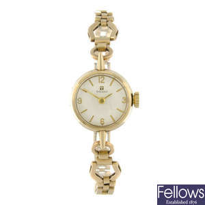 TISSOT - a lady's 9ct yellow gold bracelet watch.