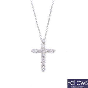 A platinum diamond cross pendant, with chain.