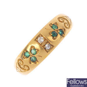 A late Victorian 18ct gold emerald and diamond band ring.