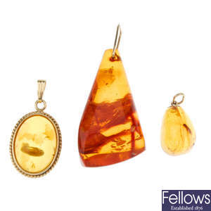 Three amber pendants.