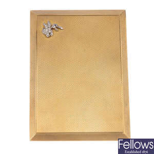 ASPREY & CO. - a 1940s 9ct gold cigarette case, with diamond and sapphire novelty accent.