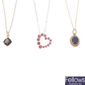 Five mostly 9ct gold gem-set pendants.
