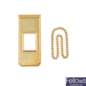 Two 9ct gold money clips.