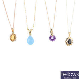 Four gem-set pendants, with chains.