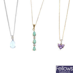 Five gem-set pendants, with chains.