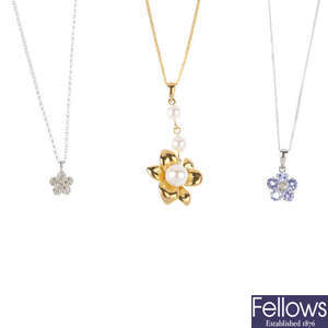 Five diamond and gem-set pendants, with chains.