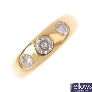 A gentleman's 14ct gold diamond three-stone ring.